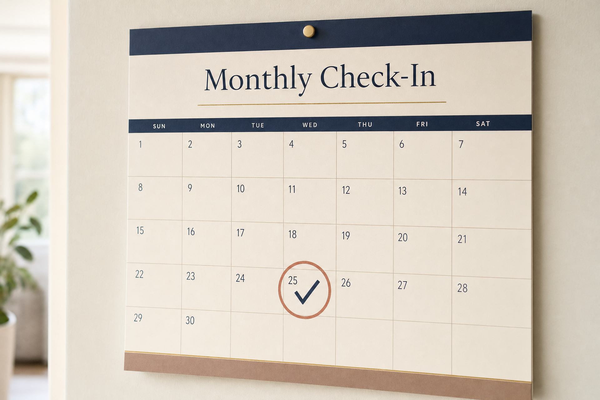 A modern monthly calendar with one date circled and marked for a monthly check-in.
